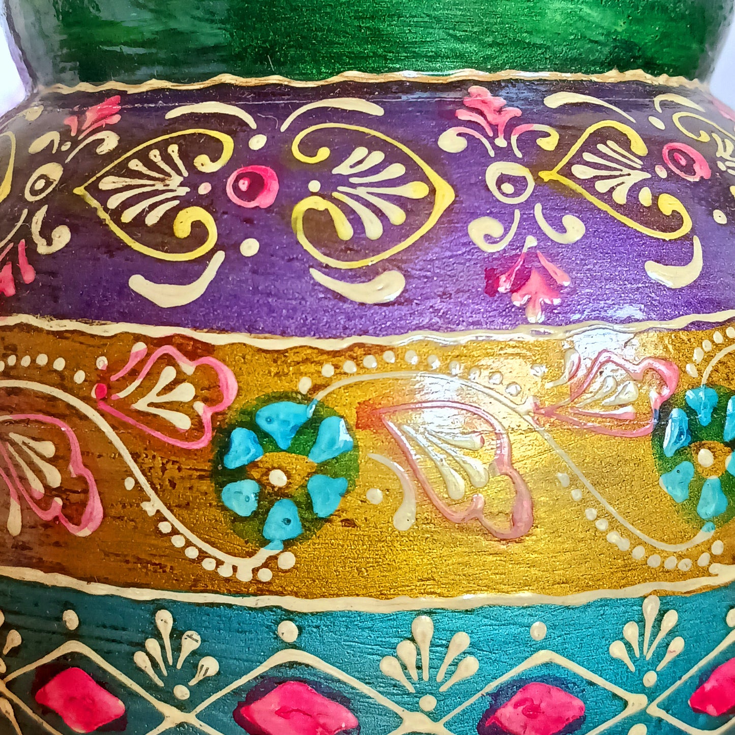 This decorative vintage style wooden pot has a detailed hand painted design. The attractive rich colour combination is set off with a pretty gem embellishment, adding texture and visual delight. An impressive entrance feature as ornamental storage or fill with dried grasses for an organic, changeable room feature.