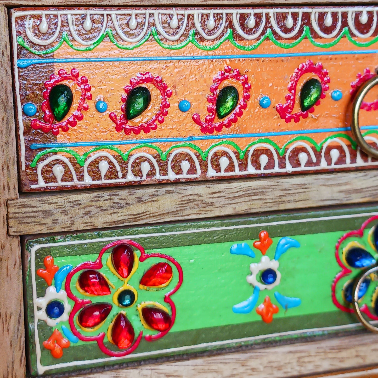 The Hindi word 'Sankalaka' is translated as 'eclectic'. The random applicaton of skillfully painted drawer panels results in this beautiful, eclectic, unique 6-drawer chest. Each panel is hand painted to perfection by highly skilled artisans. A beautiful addition to any home.