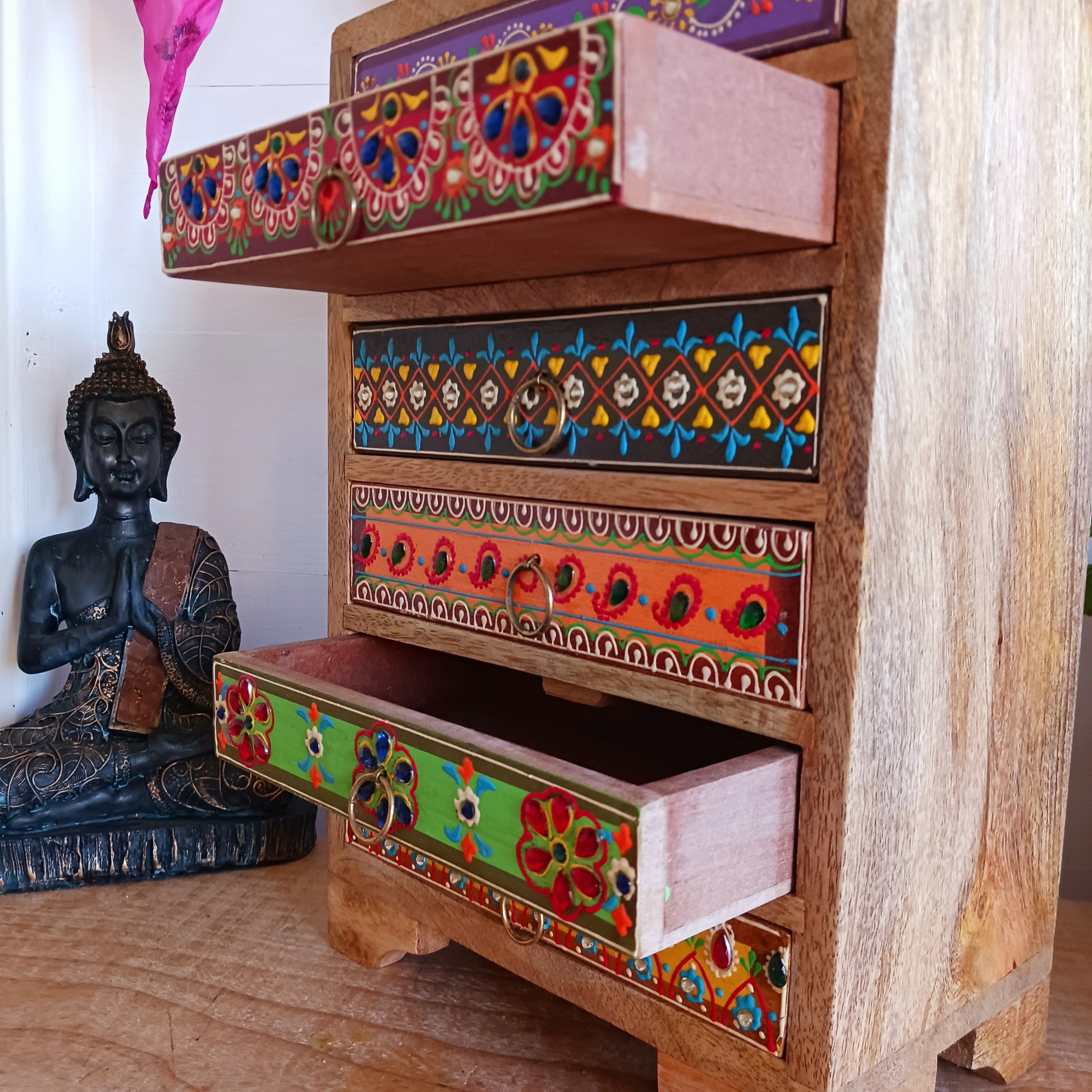 The Hindi word 'Sankalaka' is translated as 'eclectic'. The random applicaton of skillfully painted drawer panels results in this beautiful, eclectic, unique 6-drawer chest. Each panel is hand painted to perfection by highly skilled artisans. A beautiful addition to any home.