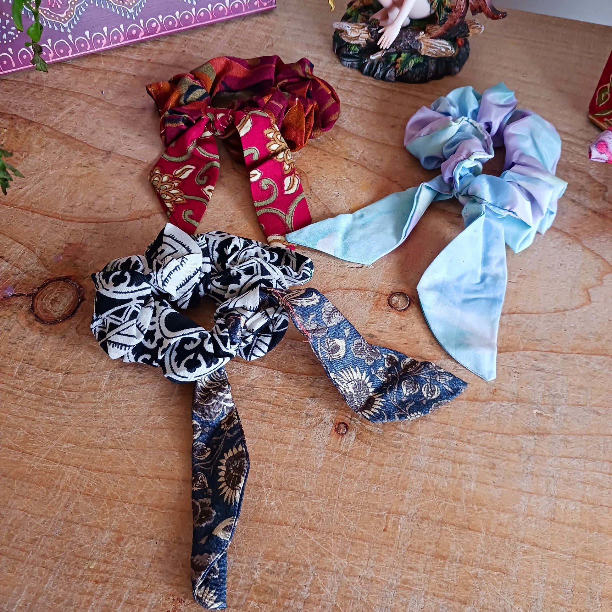 A silky sari material scrunchie styled with a trailing bow feature.  Glamorous sustainable fashion, these beautiful hair accessories come in assorted patterns and colours.