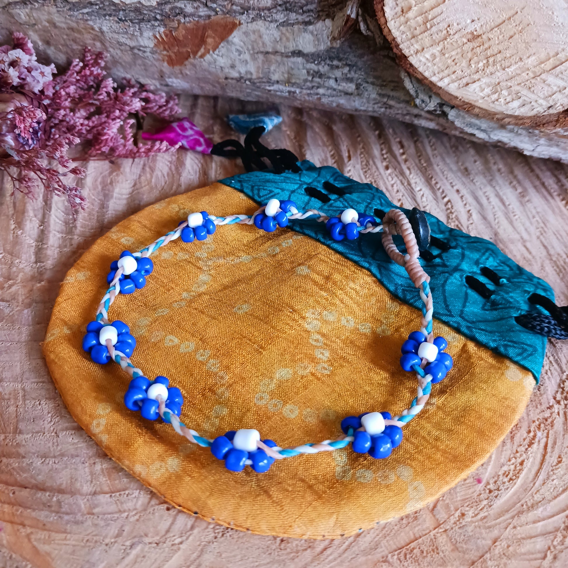 These pretty daisy anklets are made from a collection of beads and and plaited string. They each have a secure fastening and are a great addition to any summer wardrobe.