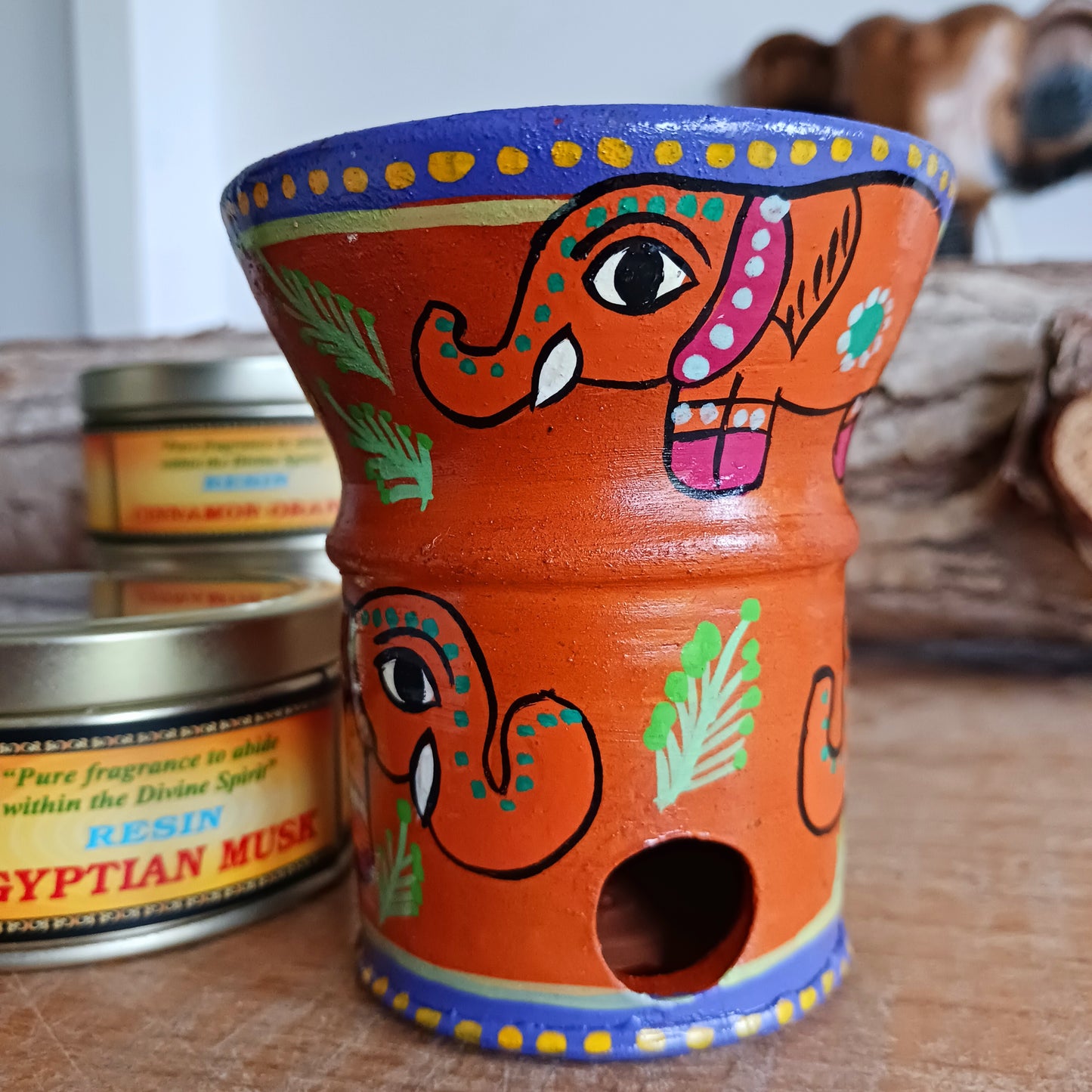 These attractive and unique little Mithila charcoal burners are hand painted in Madhyapur Thimi, just outside Kathmandu. Each piece is made in the traditional brightly coloured painting style from Mithila region. As they are hand painted each piece is unique and a variety of designs and colours are available. Perfect for burning resin incense, powders or dhoop cones.