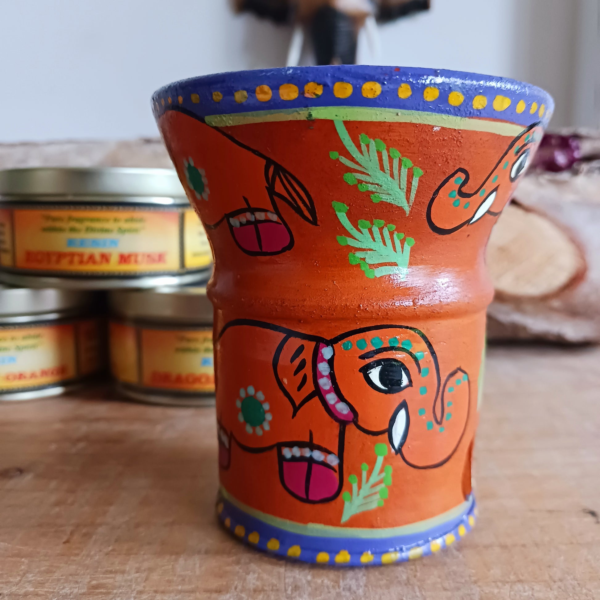 These attractive and unique little Mithila charcoal burners are hand painted in Madhyapur Thimi, just outside Kathmandu. Each piece is made in the traditional brightly coloured painting style from Mithila region. As they are hand painted each piece is unique and a variety of designs and colours are available. Perfect for burning resin incense, powders or dhoop cones.