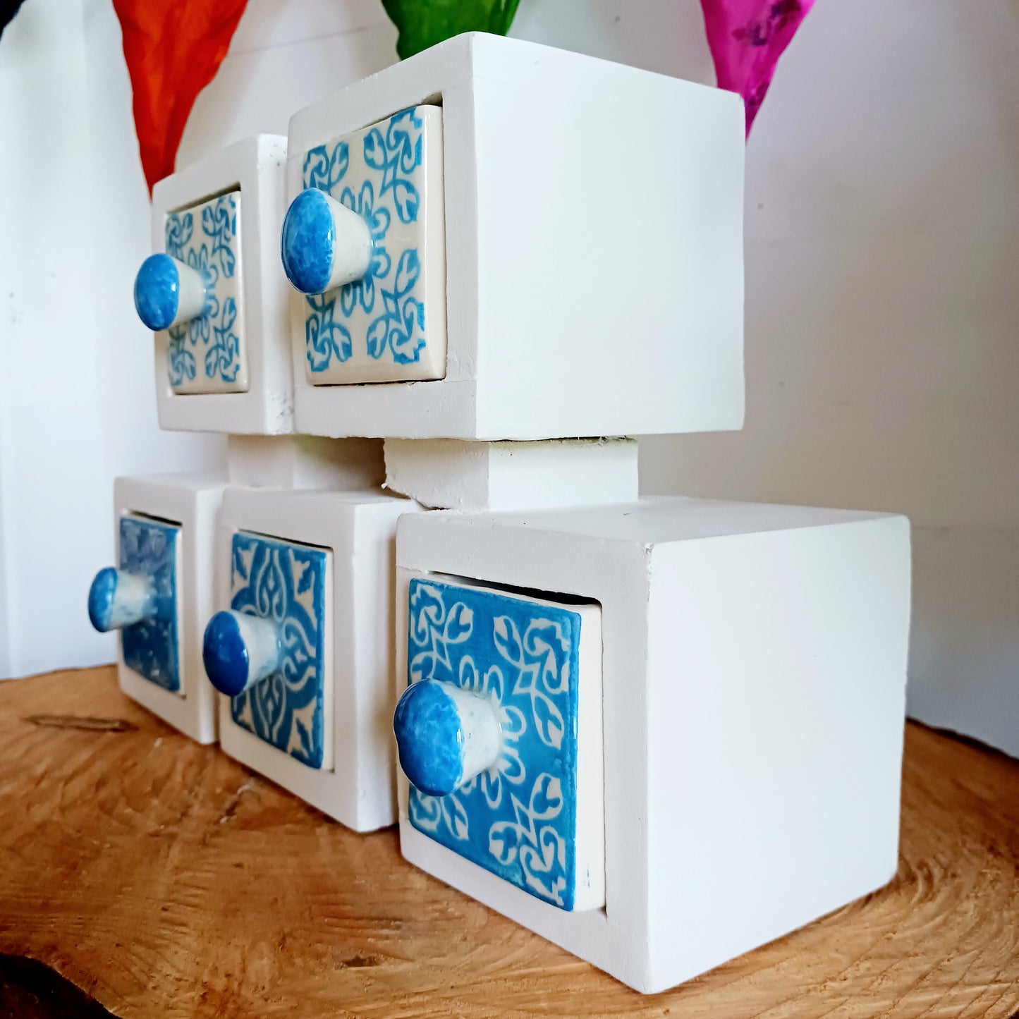 These attractive and unusual ceramic drawers are perfect for storing a hundred things! Spices, buttons, keys, trinkets, safety pins, haberdashery, knickknacks, all bits & bobs.  The wood used is mango wood and the ceramic drawers are all hand painted.