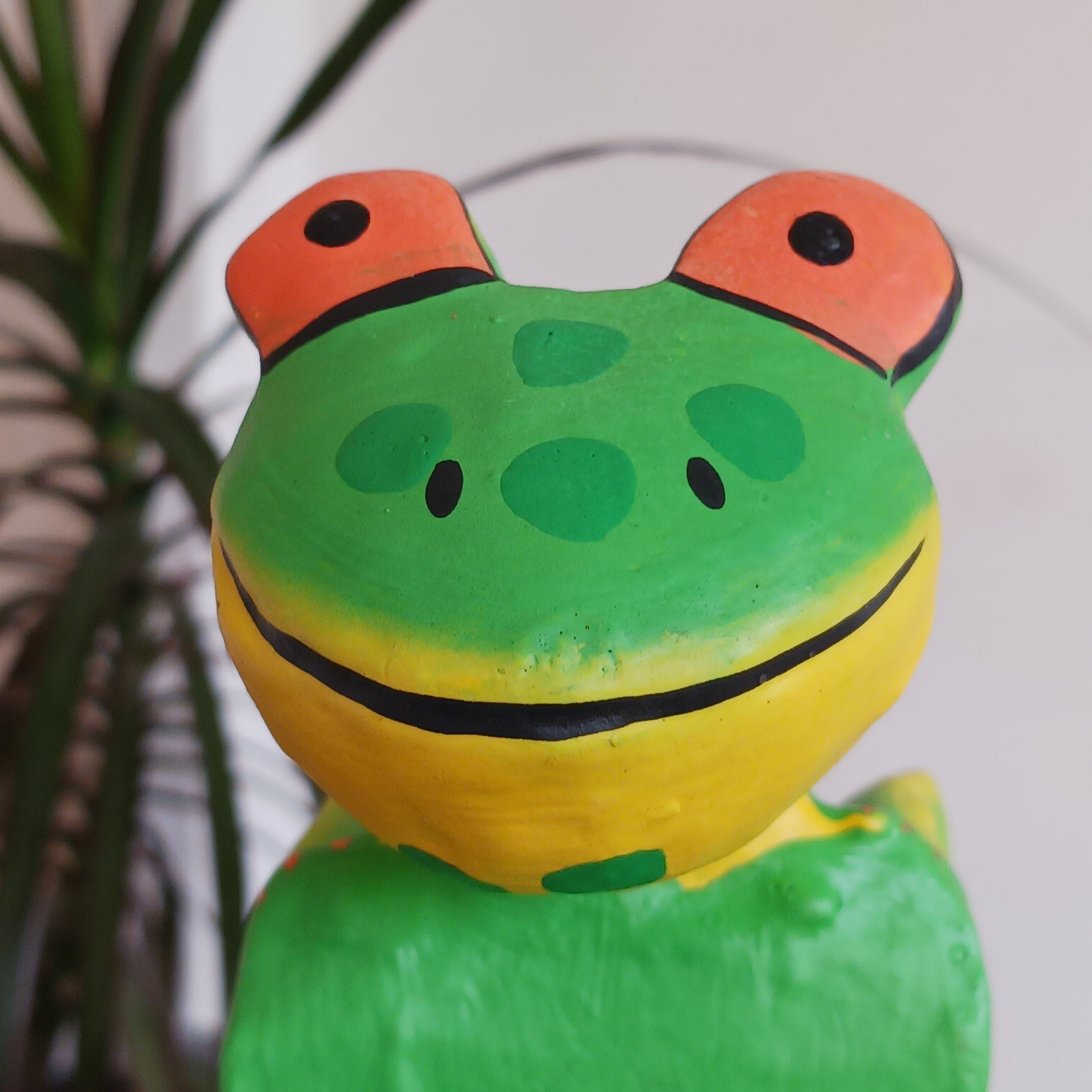 Exhibit this delightful handpainted frog on a shelf or your desk for a very cute and colourful display. Made using Albesia wood which is fast growing and sustainable.