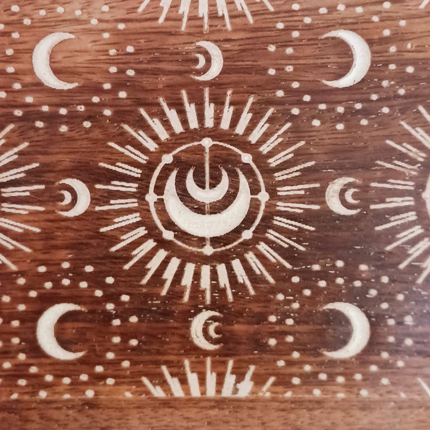 This wall mounted key hook or coat hanger has been hand carved from mango wood and decorated with crescent moons design, etched and painted white with 3 hooks for hanging. There are 2 hooks at the top on back from which to hang.