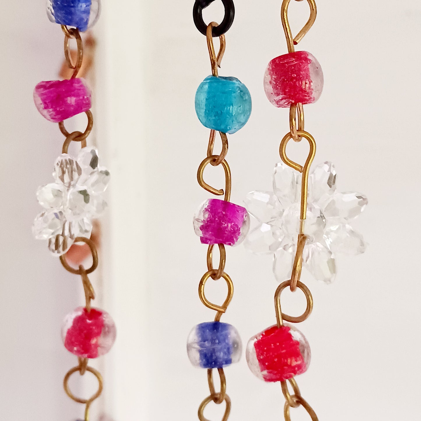 This pretty Butterfly windchime is decorated with vibrant mixed beads and Indian bells. Handmade from recycled iron, the bells make a lovely light tinking sound in a gentle breeze. Ideal for both inside the home or in your garden.