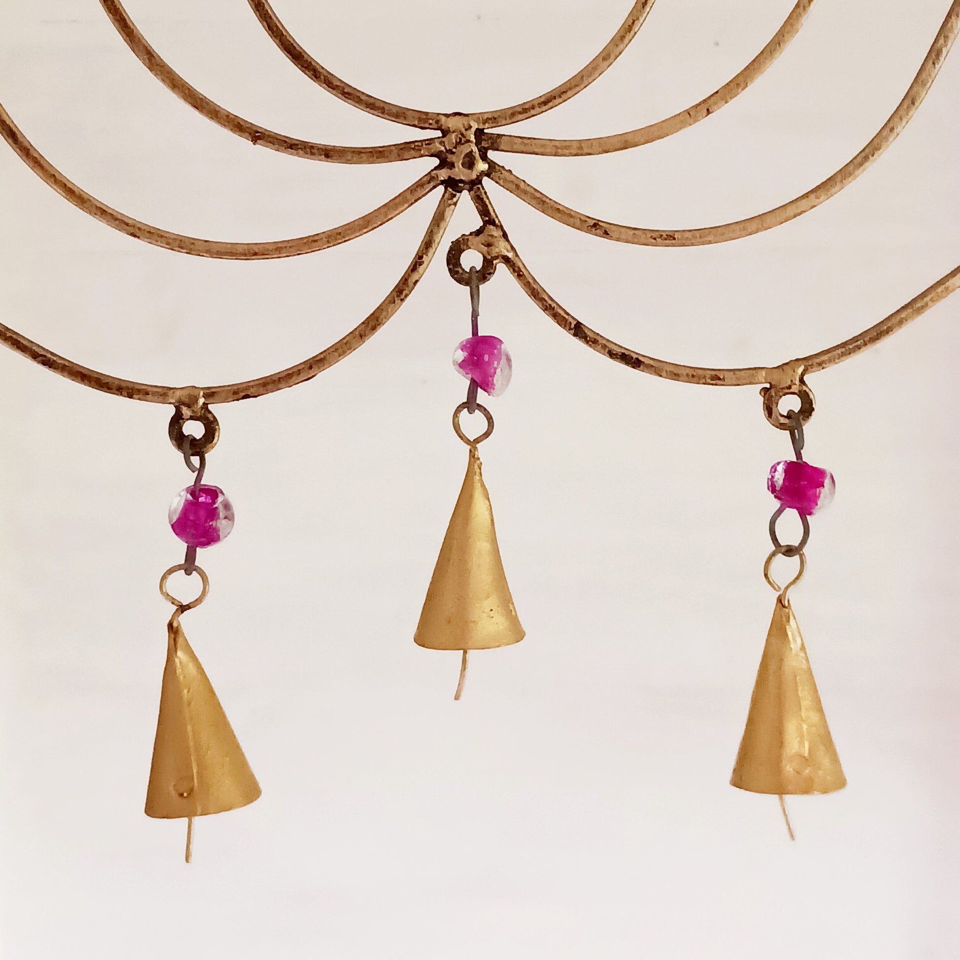 This unusual windchime has been handcrafted from recycled iron in the shape of a Lotus flower. There are 18 hangings, each with an Indian bell at the bottom. The recycled metal gives the windchime a wonderful rustic look, and the Indian bells make a lovely sound in a gentle breeze.