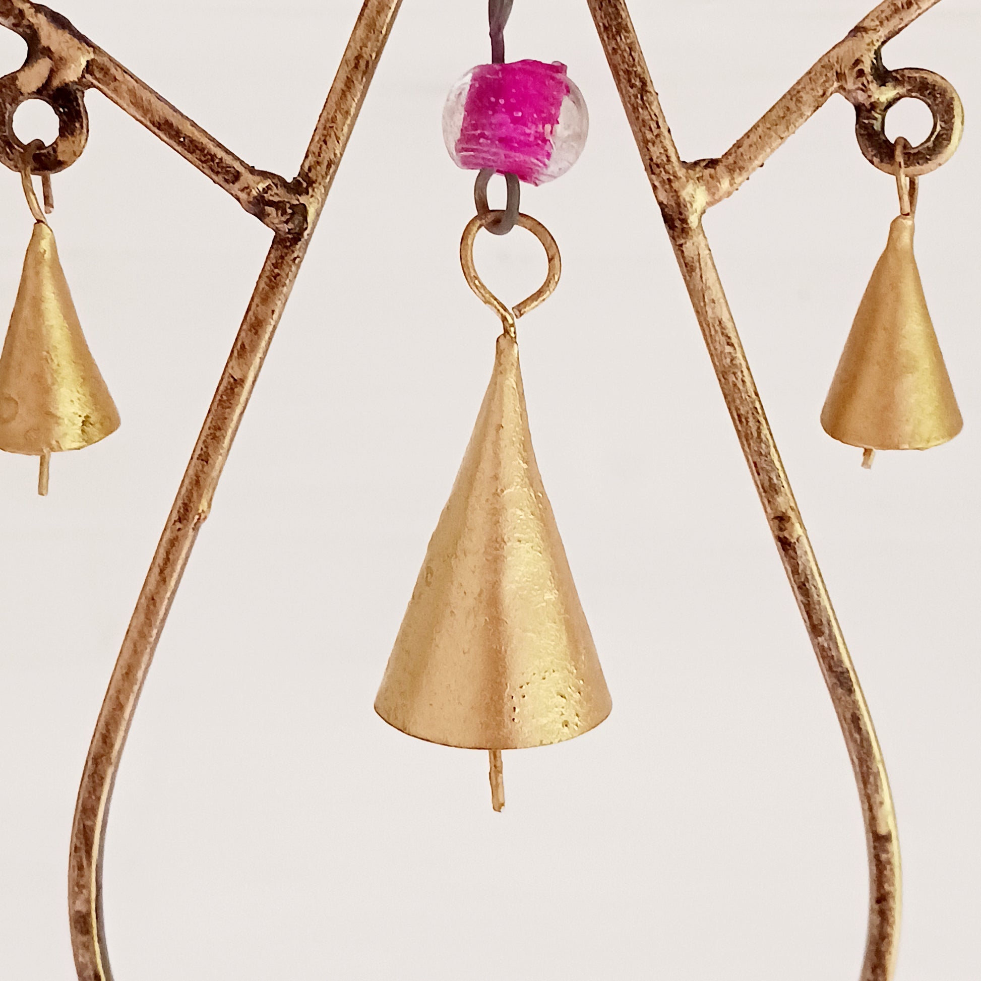 This unusual windchime has been handcrafted from recycled iron in the shape of a Lotus flower. There are 18 hangings, each with an Indian bell at the bottom. The recycled metal gives the windchime a wonderful rustic look, and the Indian bells make a lovely sound in a gentle breeze.