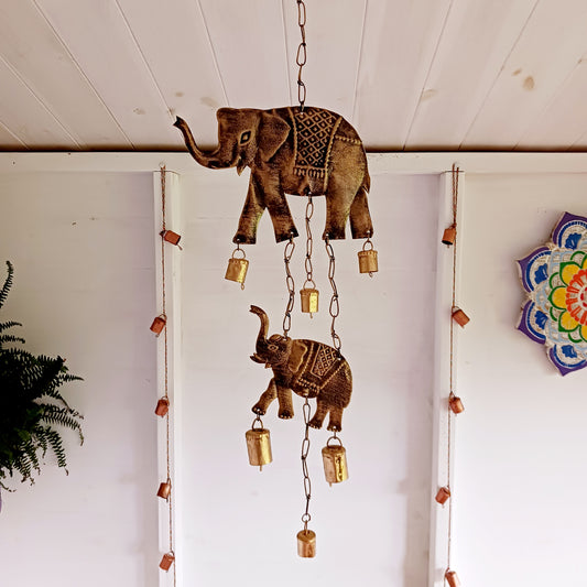 This beautiful and simple little windchime has two elephants and rasai brass effect cow bells, ideal for both inside the home or the garden. The Indian bells are made from recycled iron and make a light sound that is very pleasing on the ear.