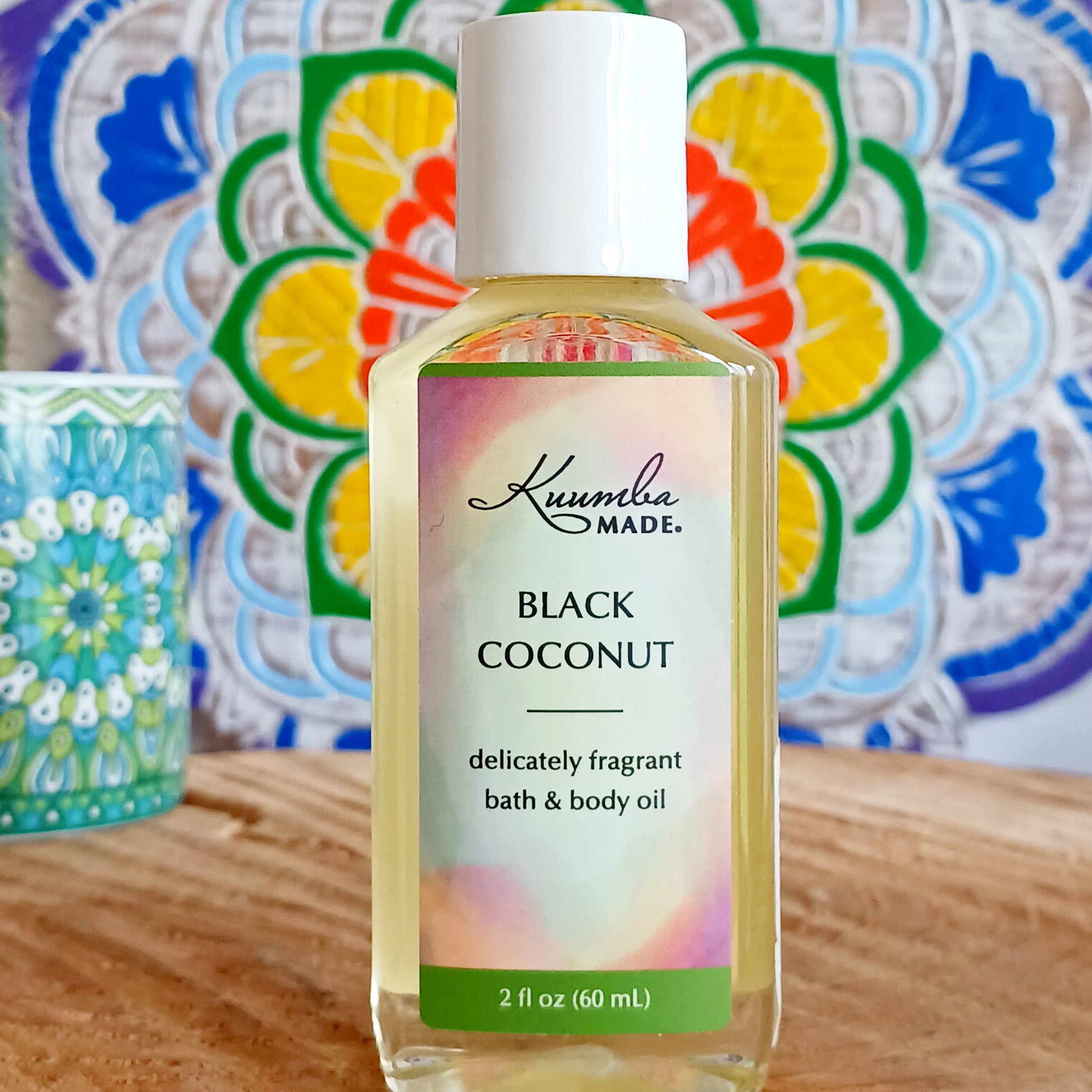 A rich coconut fragrance balanced with notes of creamy sweetness. Perfect for hot summer days and sultry nights, fast absorbing Black Coconut versatile Bath and Body Oil is packed with moisturizing agents that leave skin and hair radiant, healthy and softly aromatic. Use for daily moisturizing, a lavish massage, a nourishing bath, and as a deep conditioning hair treatment. Made with organic ingredients.