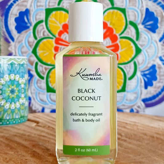 A rich coconut fragrance balanced with notes of creamy sweetness. Perfect for hot summer days and sultry nights, fast absorbing Black Coconut versatile Bath and Body Oil is packed with moisturizing agents that leave skin and hair radiant, healthy and softly aromatic. Use for daily moisturizing, a lavish massage, a nourishing bath, and as a deep conditioning hair treatment. Made with organic ingredients.