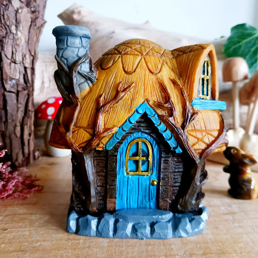 This adorable and detailed incense cone burner is shaped like a little fairy house called Buttercup Cottage. 
 Designed by Lisa Parker, you place an incense cone inside the cottage and watch as smoke rises from the chimney. The house comes in a little gift box making it the perfect gift for fairy and incense lovers!