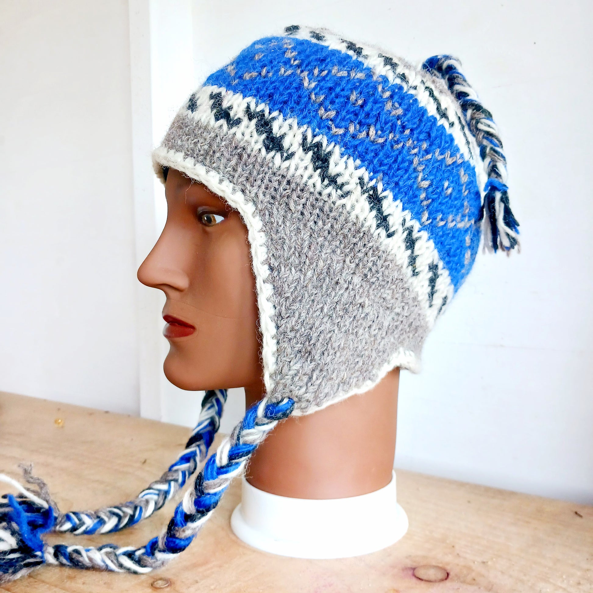 Chunky wool earflap hats hand made in Nepal with fleece lining for extra warmth and comfort, this handmade hat is awesomely warm.