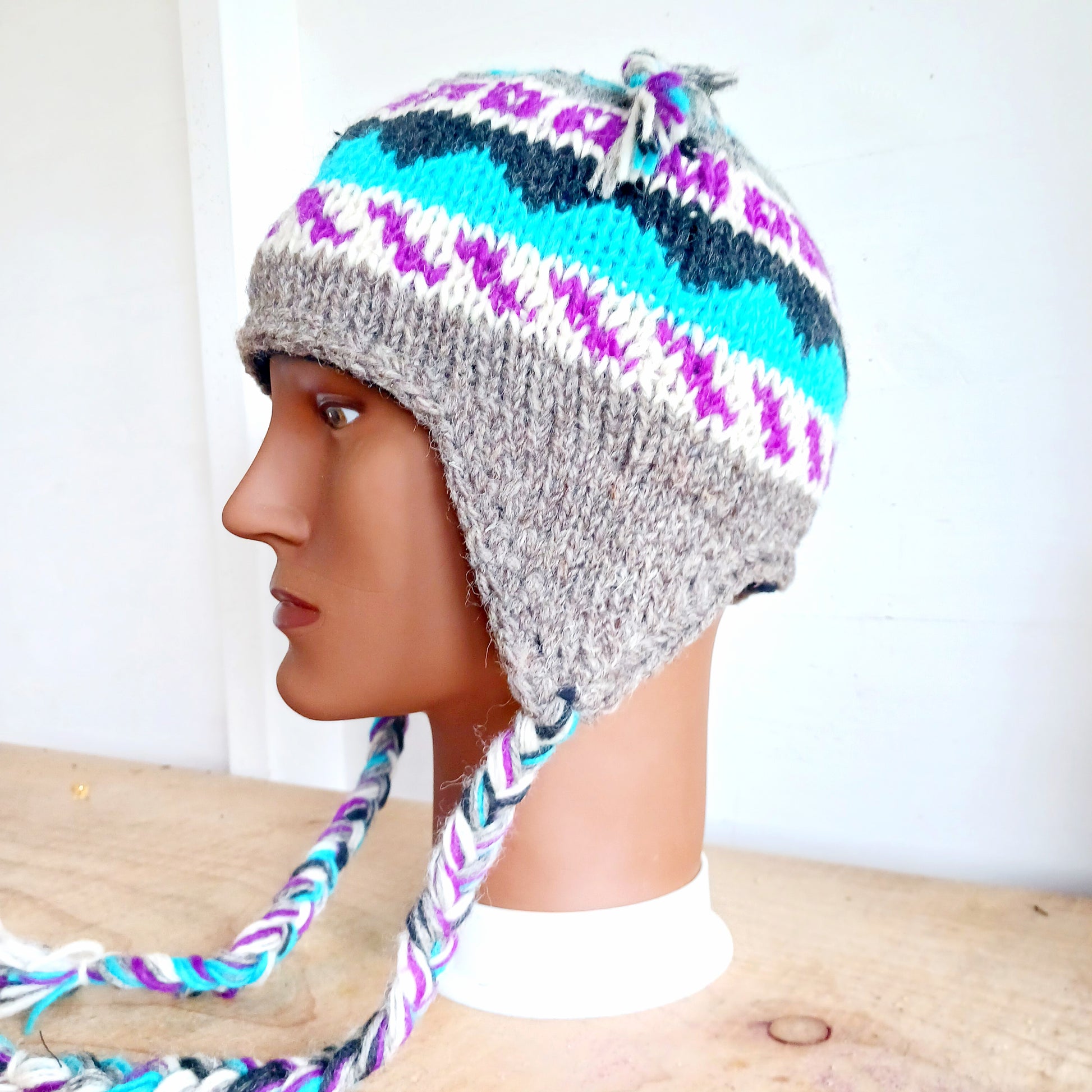 Chunky wool earflap hats hand made in Nepal with fleece lining for extra warmth and comfort, this handmade hat is awesomely warm.