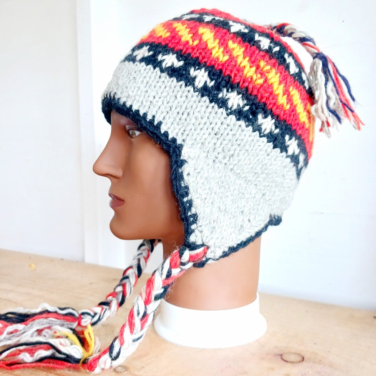 Chunky wool earflap hats hand made in Nepal with fleece lining for extra warmth and comfort, this handmade hat is awesomely warm.