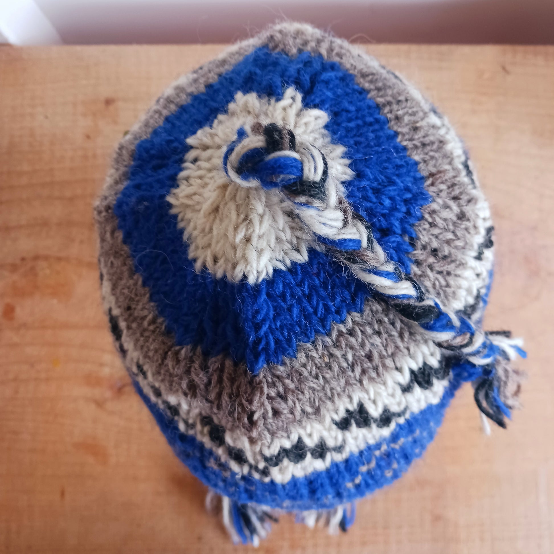 Chunky wool earflap hats hand made in Nepal with fleece lining for extra warmth and comfort, this handmade hat is awesomely warm.