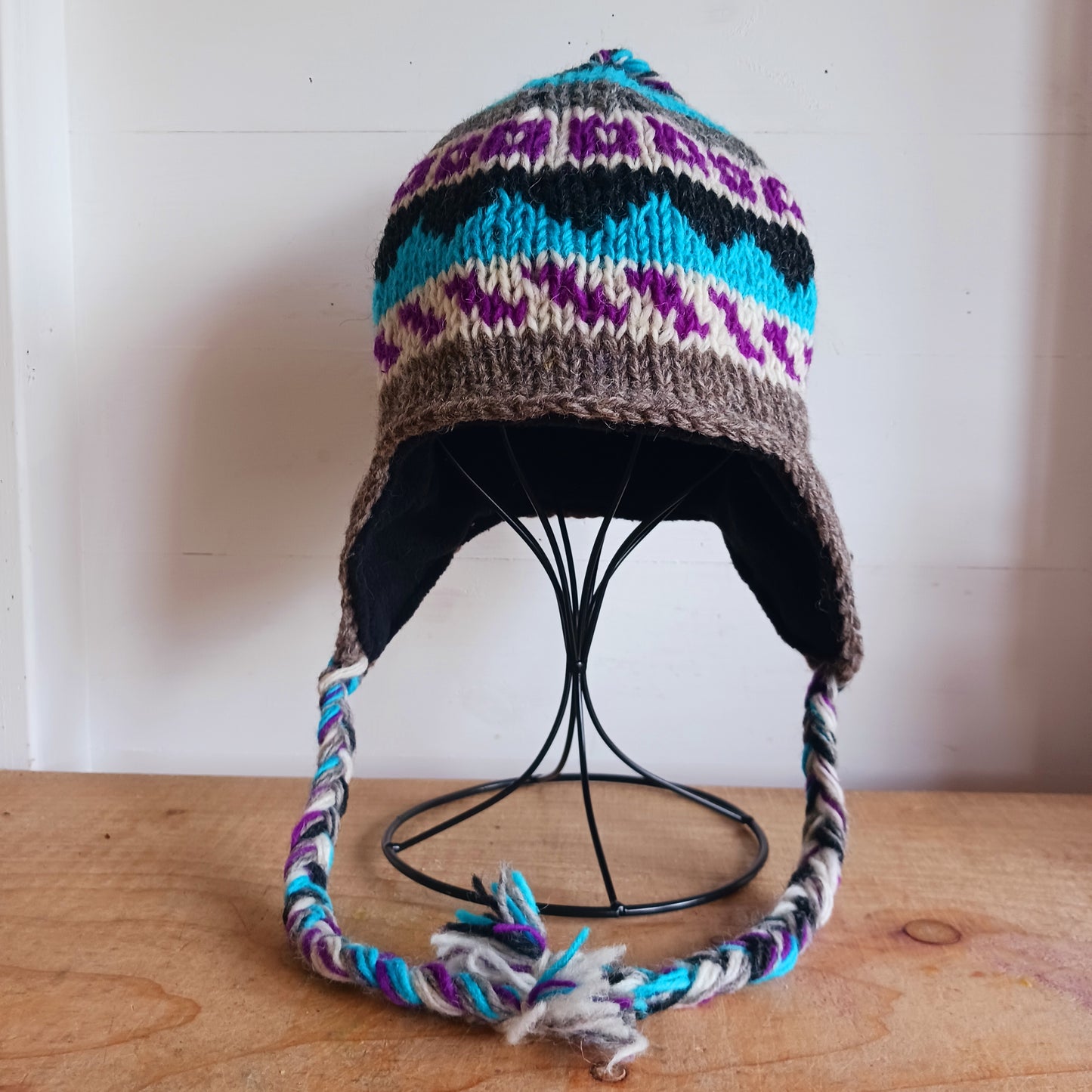 Chunky wool earflap hats hand made in Nepal with fleece lining for extra warmth and comfort, this handmade hat is awesomely warm.