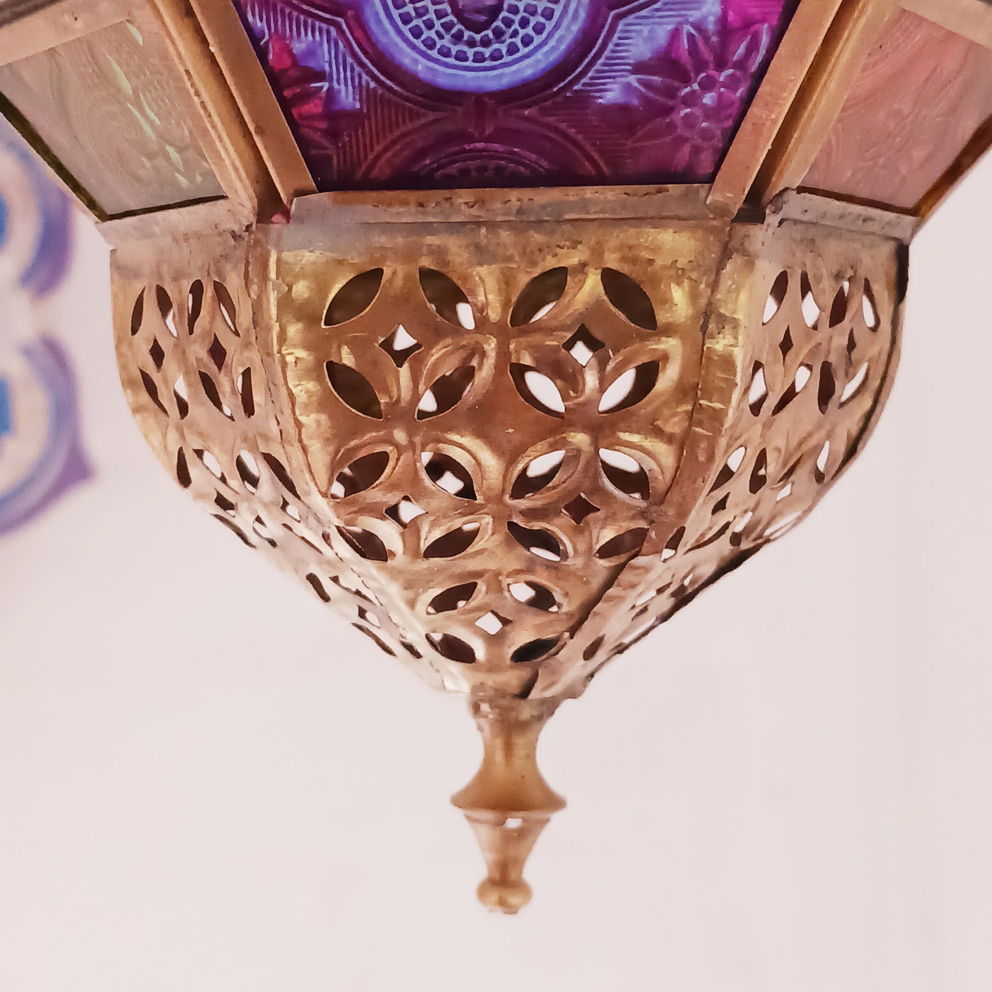 These stunning hanging tealight lanterns feature a rich combination of embossed coloured glass against intricate metal crafted design. Add a warming touch to evenings and enjoy the soothing ambience of natural light against lustrous colour. Super for entertaining inside or out, this gorgeous creation is sure to be a conversation booster!