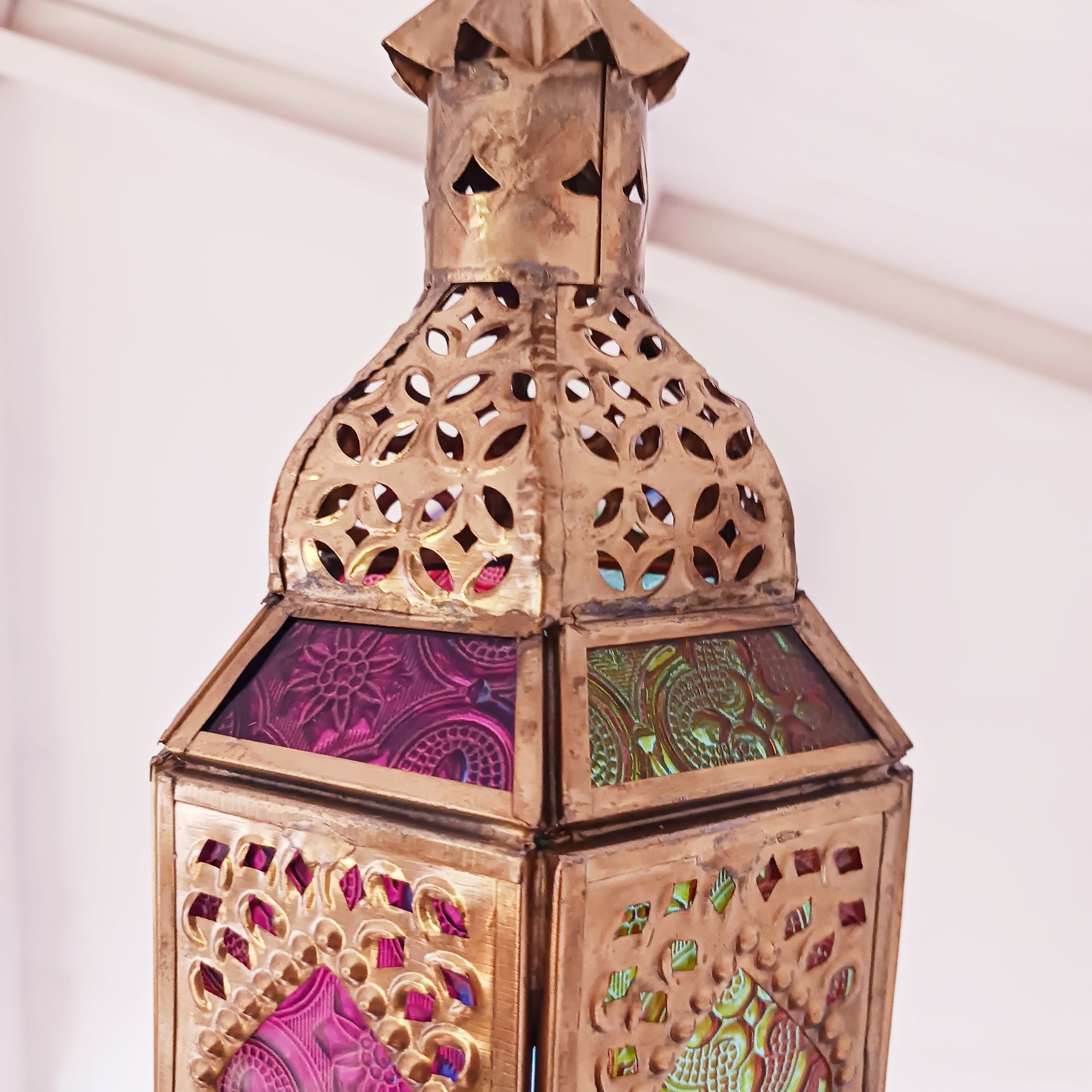 These stunning hanging tealight lanterns feature a rich combination of embossed coloured glass against intricate metal crafted design. Add a warming touch to evenings and enjoy the soothing ambience of natural light against lustrous colour. Super for entertaining inside or out, this gorgeous creation is sure to be a conversation booster!