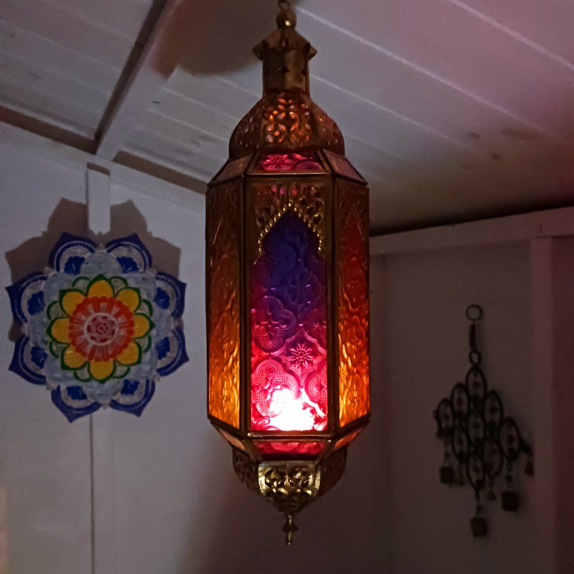 These stunning Moroccan style hanging tealight lanterns feature a rich combination of embossed coloured glass against intricate metal crafted design. Add a warming touch to evenings and enjoy the soothing ambience of natural light against lustrous colour. Super for entertaining inside or out, this gorgeous creation is sure to be a conversation piece!