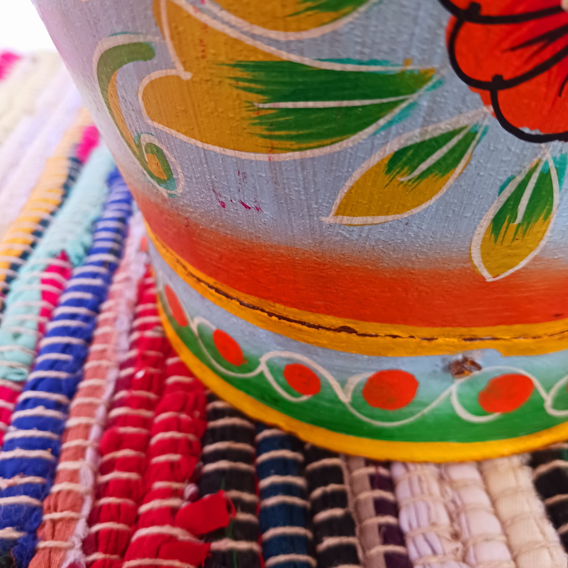 Hand painted in a turquoise floral design, a vintage style iron plant pot to display as a decorative indoor/outdoor planter. Lovingly hand painted by skilled artisans on a fair trade basis in the Indian desert city of Jodhpur. Fill the striking container with a flowering or contrasting potted plant. Grow seasonal bulbs to bring life and inspiration.