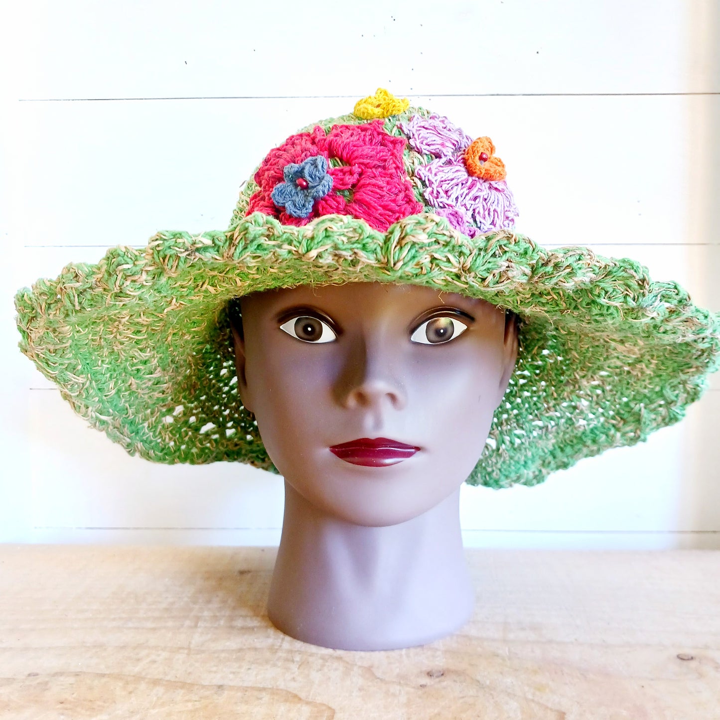 Hand-knitted Hemp & Cotton Boho Festival Hat with Rainbow band. A unique accessory that beautifully embodies the free-spirited essence of Bohemian style. Handcrafted with care, each of these hats is a harmonious blend of hemp and cotton, resulting in a distinctive piece that exudes both fashion and sustainability. They're ideal for music festivals, beach outings, or simply just to brighten up any outfit.