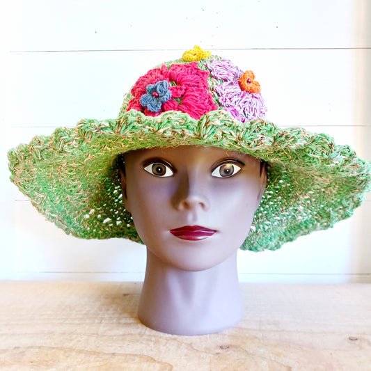 Hand-knitted Hemp & Cotton Boho Festival Hat with Rainbow band. A unique accessory that beautifully embodies the free-spirited essence of Bohemian style. Handcrafted with care, each of these hats is a harmonious blend of hemp and cotton, resulting in a distinctive piece that exudes both fashion and sustainability. They're ideal for music festivals, beach outings, or simply just to brighten up any outfit.