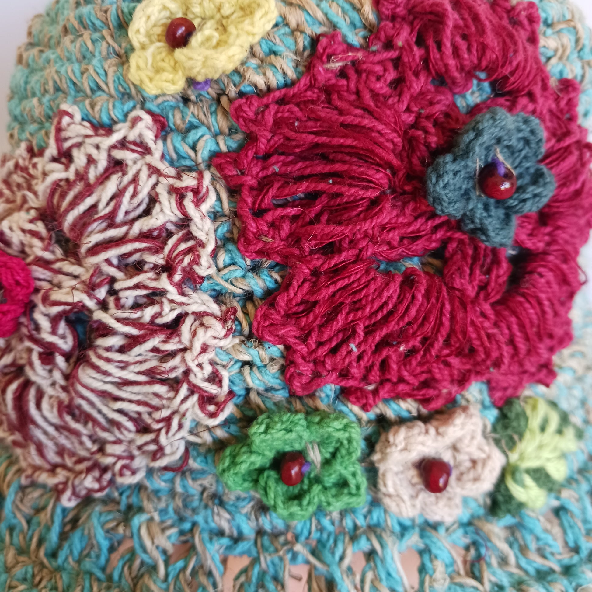 Handmade hemp & cotton boho festival hat with crochet flowers. A unique accessory that beautifully embodies the free-spirited essence of Bohemian style. Handcrafted with care and creativity, each of these hats is a harmonious blend of hemp and cotton, resulting in a distinctive piece that exudes both fashion and sustainability. They're ideal for music festivals, beach outings, or simply just to brighten up any outfit.