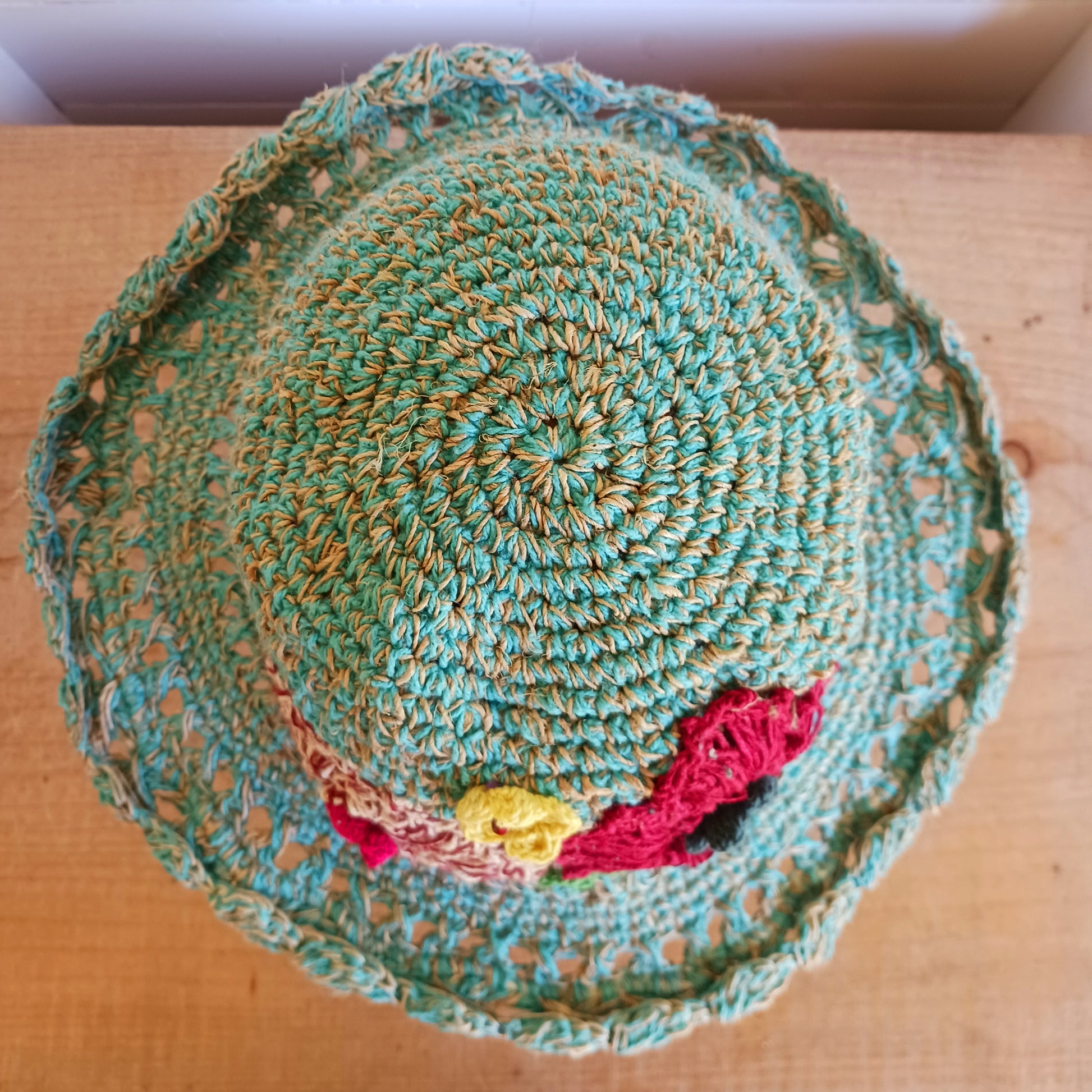 Handmade hemp & cotton boho festival hat with crochet flowers. A unique accessory that beautifully embodies the free-spirited essence of Bohemian style. Handcrafted with care and creativity, each of these hats is a harmonious blend of hemp and cotton, resulting in a distinctive piece that exudes both fashion and sustainability. They're ideal for music festivals, beach outings, or simply just to brighten up any outfit.
