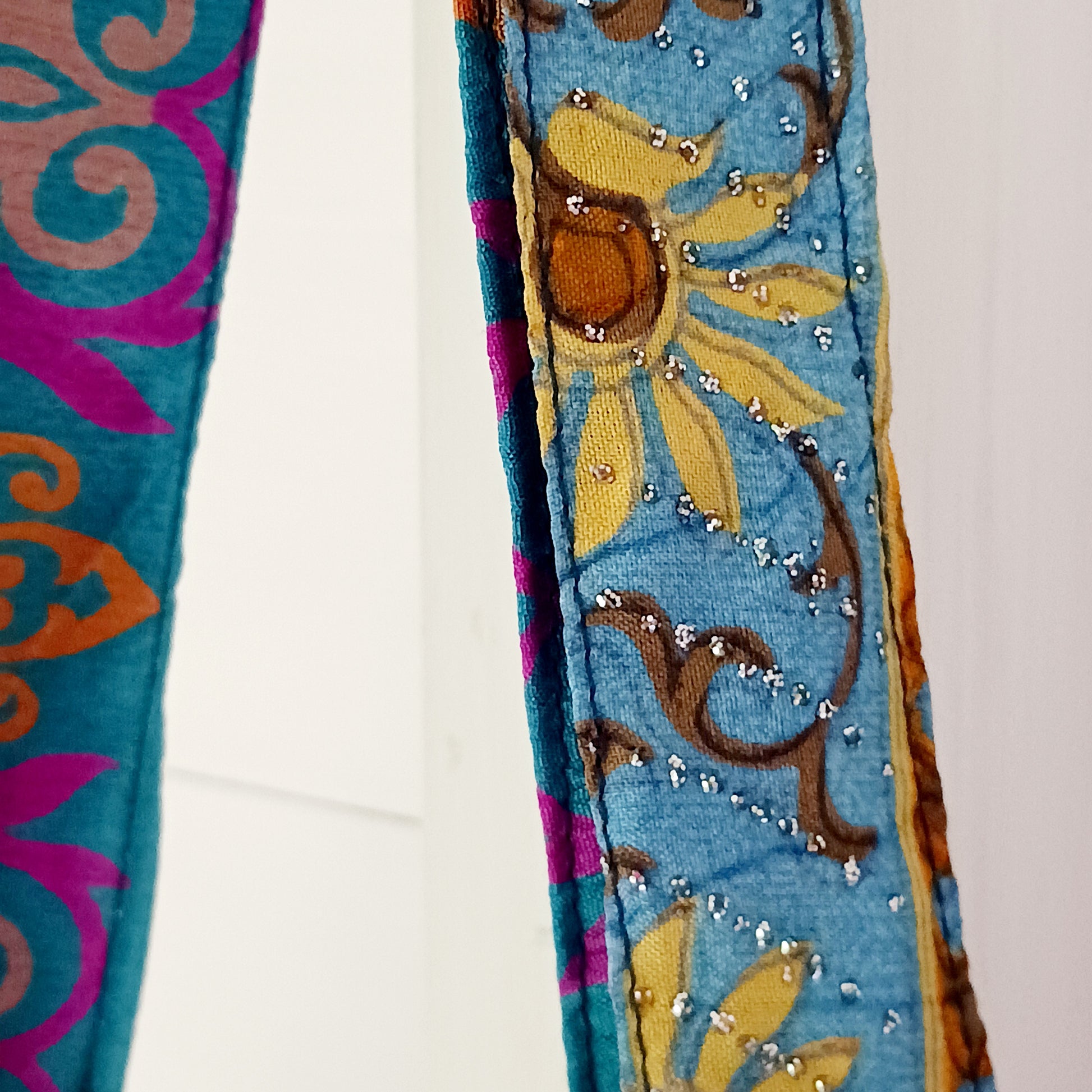 Shop like a pro! Pack this strong yet lightweight tote bag of colourful sari fabric with a black polyester lining. It's perfect for stuffing in your backpack, PC bag, cabin case, or glove box. The bag features a handy zippered external pocket for small bits and bobs like keys and coins.