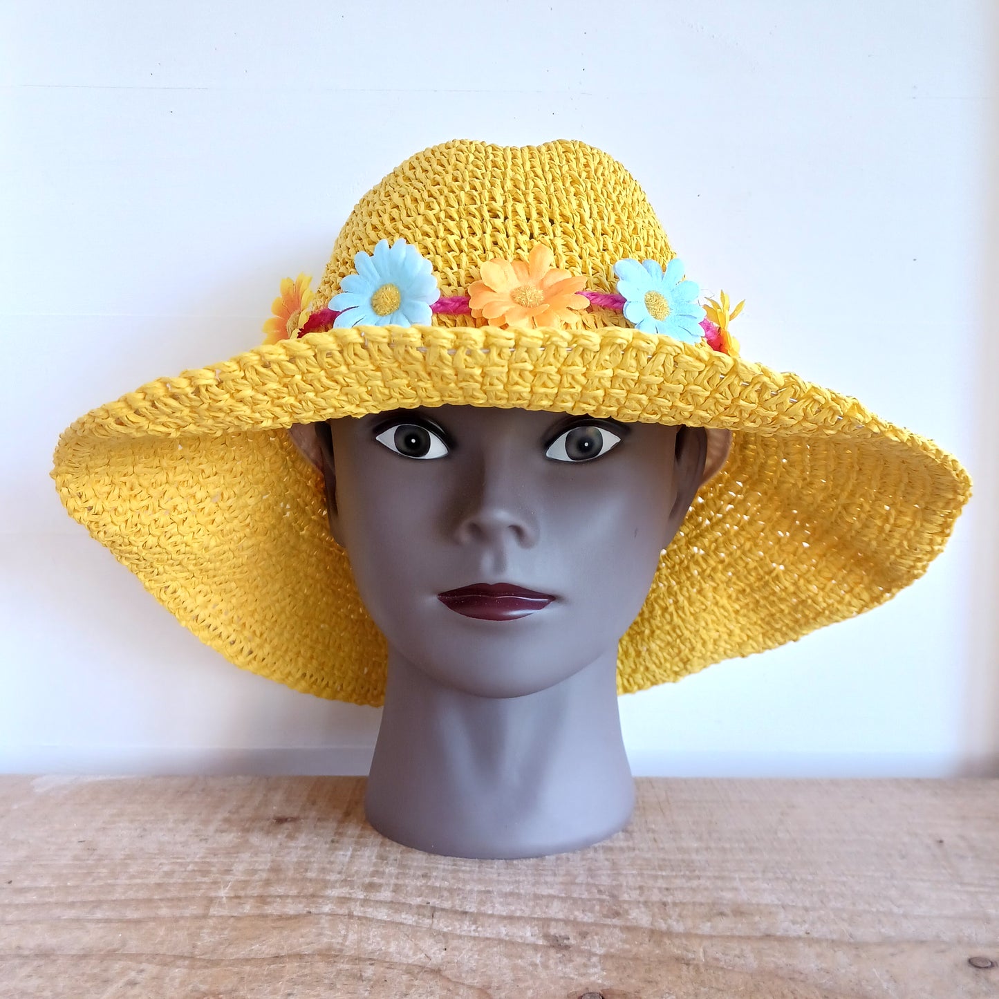 Bring effortless style and sun-safe comfort to your holiday wardrobe with this Floppy Straw Sun Hat in vibrant yellow. This delightful hat features a soft, flowing brim that drapes elegantly, creating a relaxed, free-spirited look perfect for travel, beach days, or casual outings.