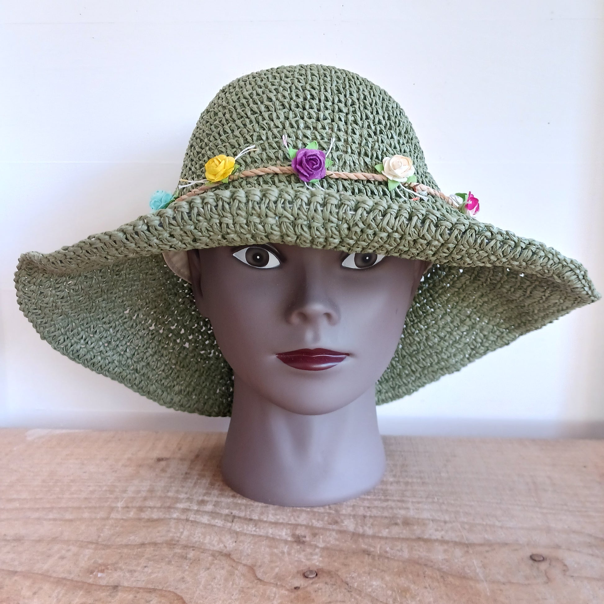 Bring effortless style and sun-safe comfort to your holiday wardrobe with this Floppy Straw Sun Hat in moss green. This delightful hat features a soft, flowing brim that drapes elegantly, creating a relaxed, free-spirited look perfect for travel, beach days, or casual outings.