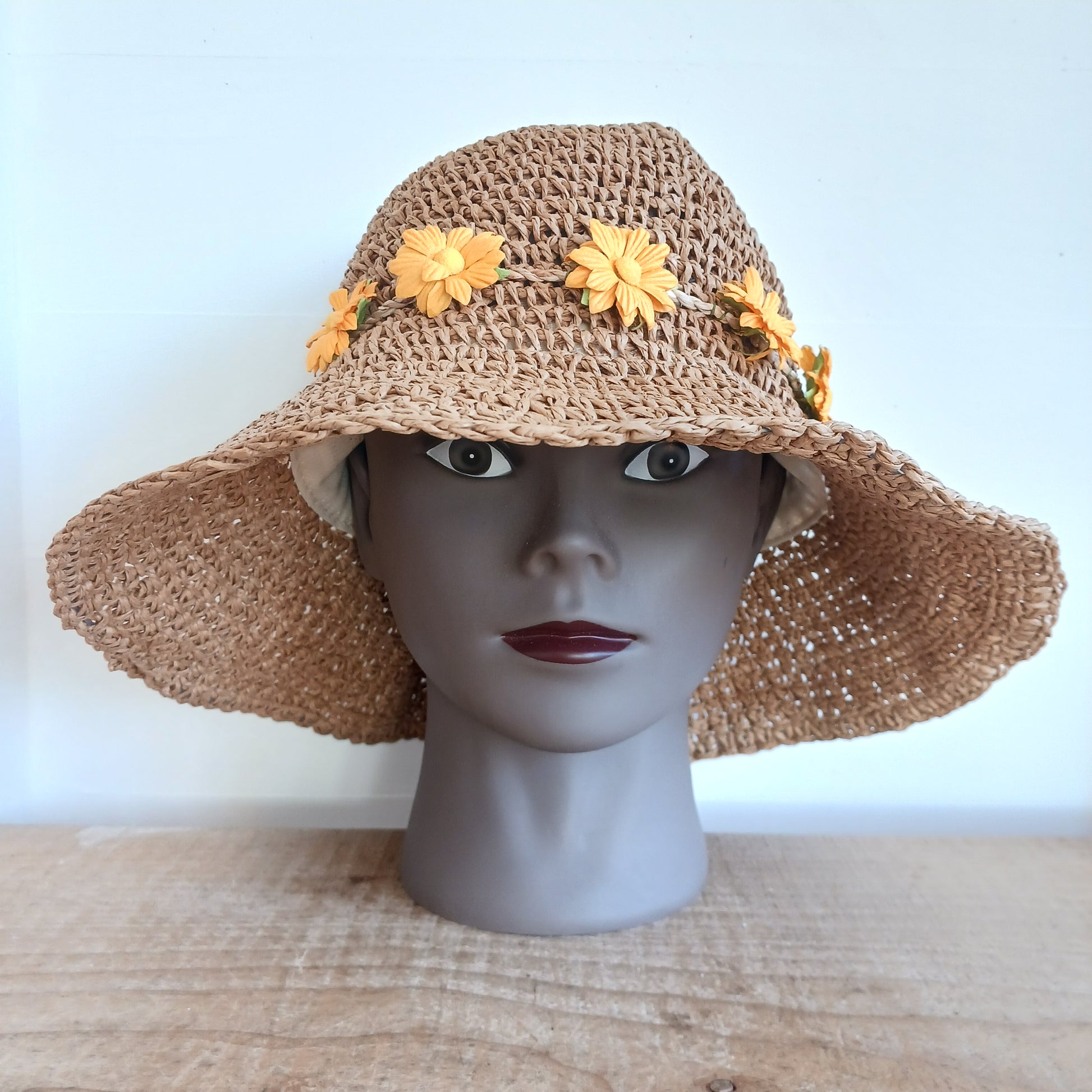 Bring effortless style and sun-safe comfort to your holiday wardrobe with this Floppy Straw Sun Hat in Natural Coffee. This delightful hat features a soft, flowing brim that drapes elegantly, creating a relaxed, free-spirited look perfect for travel, beach days, or casual outings.
