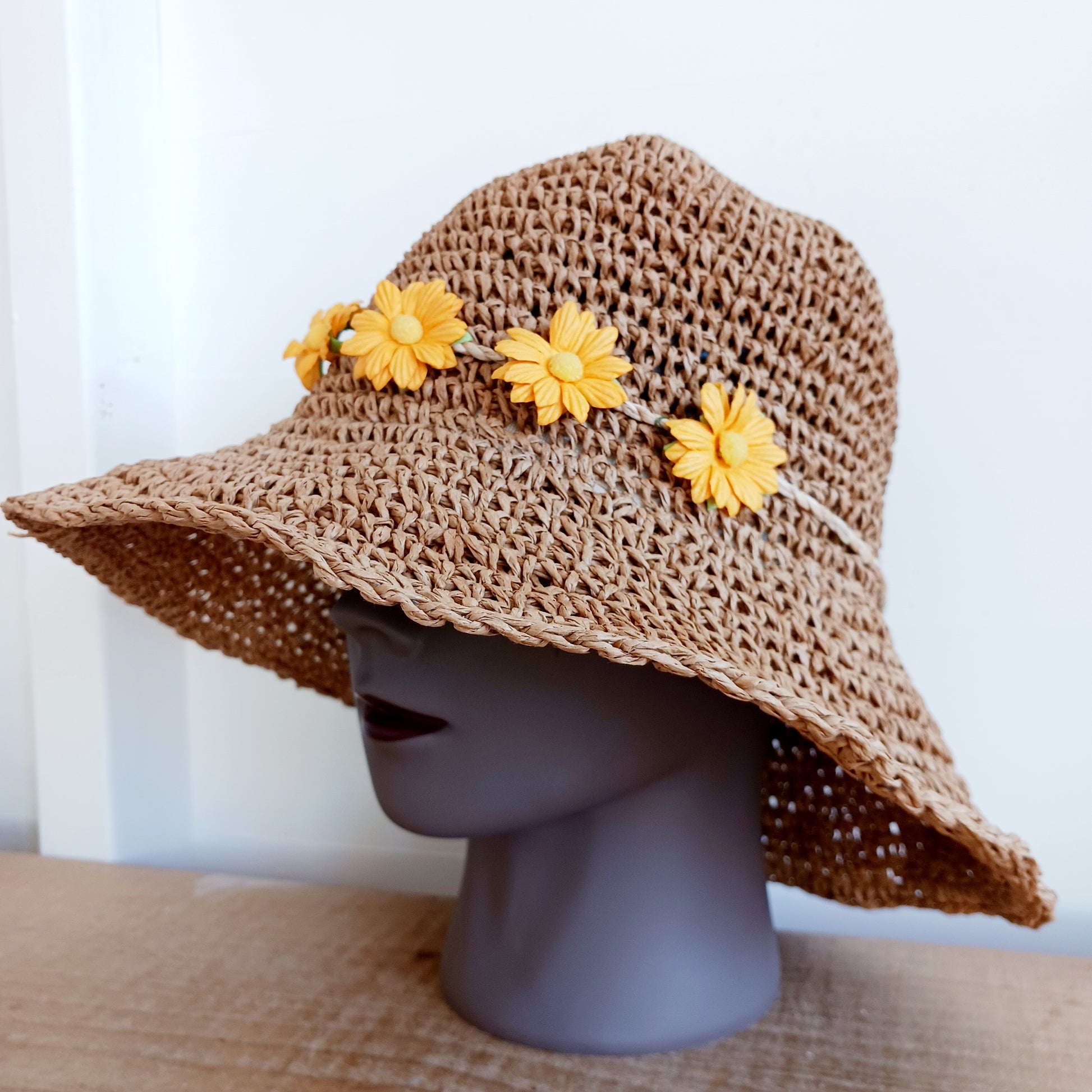 Bring effortless style and sun-safe comfort to your holiday wardrobe with this Floppy Straw Sun Hat in Natural Coffee. This delightful hat features a soft, flowing brim that drapes elegantly, creating a relaxed, free-spirited look perfect for travel, beach days, or casual outings.