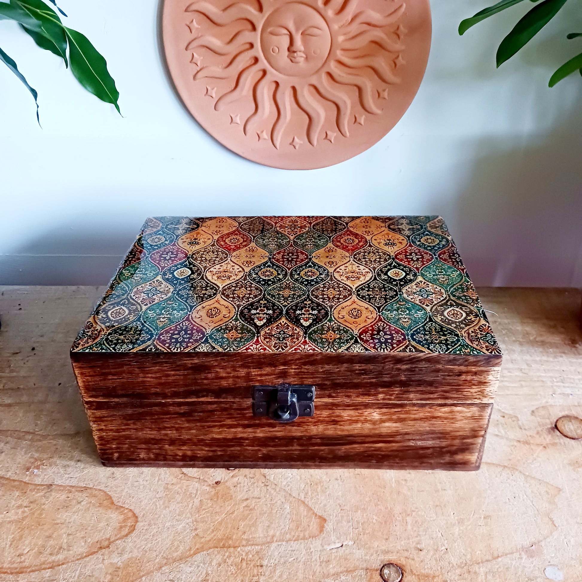 Add a touch of cultural elegance to your home with this Ceramic Glazed Wood Box. Expertly crafted, it combines the durability of solid wood with the glossy sophistication of glazed ceramic, making it both functional and decorative.