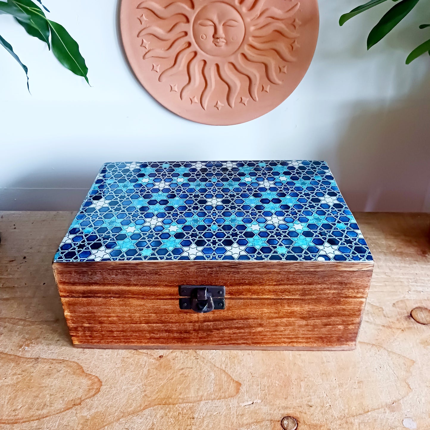 Add a touch of cultural elegance to your home with this Ceramic Glazed Wood Box. Expertly crafted, it combines the durability of solid wood with the glossy sophistication of glazed ceramic, making it both functional and decorative.