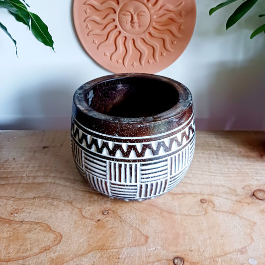 Bring authentic Balinese craftsmanship into your home with this hand-carved tribal wooden pot. Perfect for storing trinkets, small treasures, or displaying your favourite plants, this versatile pot adds a touch of boho charm to any space.