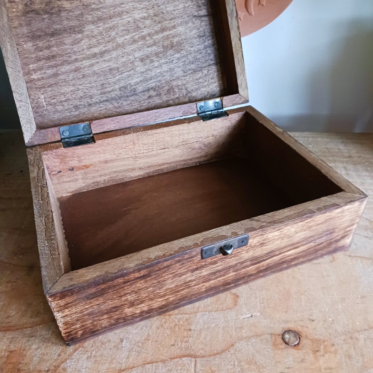 Add a touch of cultural elegance to your home with this Ceramic Glazed Wood Box. Expertly crafted, it combines the durability of solid wood with the glossy sophistication of glazed ceramic, making it both functional and decorative.