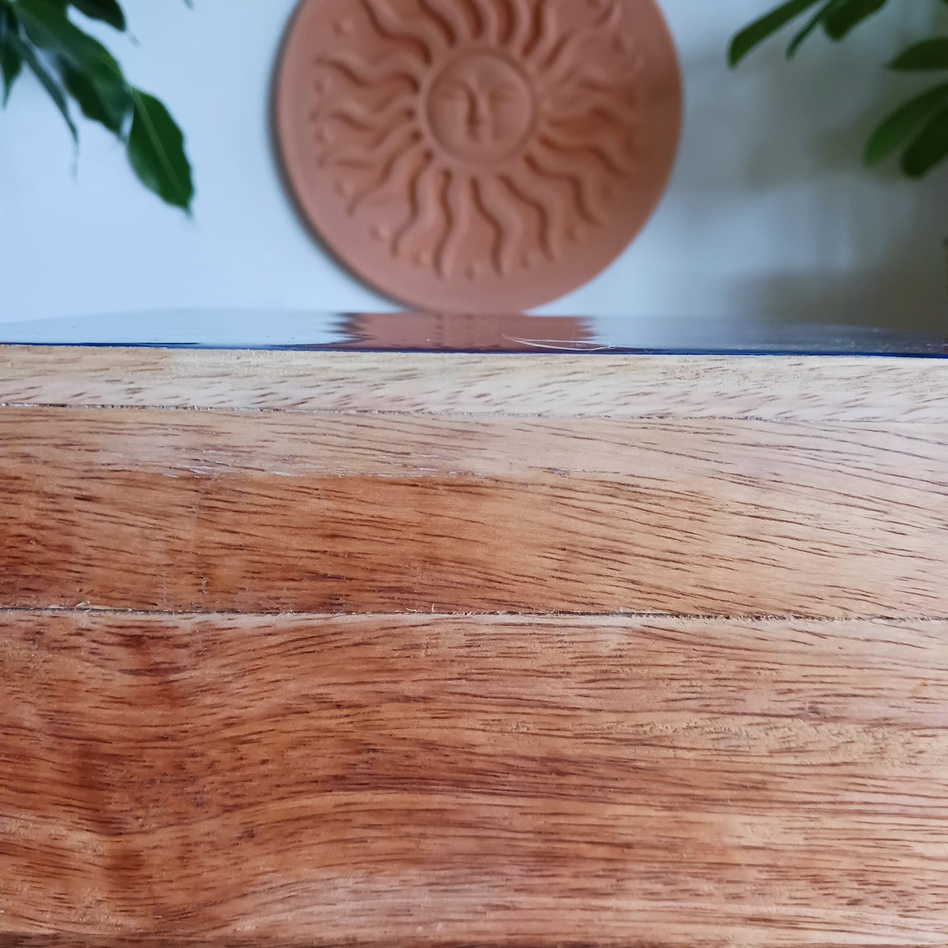 Illuminate your space with the Hop Hare Big Enamelled Square Box, a handcrafted treasure that blends beauty, spirituality, and functionality. Made from sustainable mango wood and adorned with deep blue enamel, this large storage box features a radiant golden sun design symbolizing success, confidence, joy, and vitality.