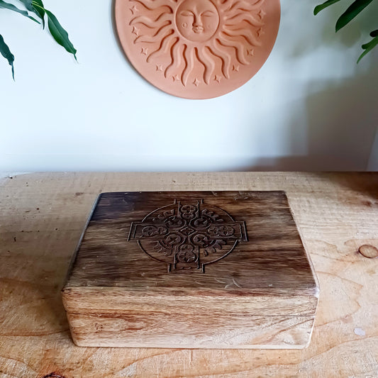 Add timeless craftsmanship to your home with this beautifully hand carved mango wood keepsake box, featuring an intricate Celtic cross design engraved on the lid. Expertly crafted from durable, sustainable mango wood, this decorative wooden box blends traditional Celtic artistry with practical storage.