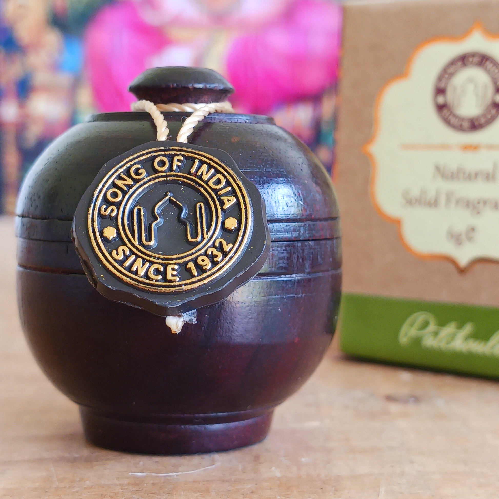 Experience the timeless beauty of jasmine with this luxurious Song of India Patchouli Fragrance Cream, beautifully housed in a handcrafted rosewood jar. Made by skilled artisans using carefully selected Indian rosewood bark, each container showcases unique natural grain patterns, colours, and veins, making every piece a one-of-a-kind collectible.