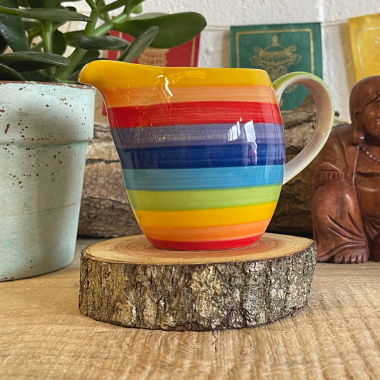 Hand painted rainbow stripe ceramic milk jug