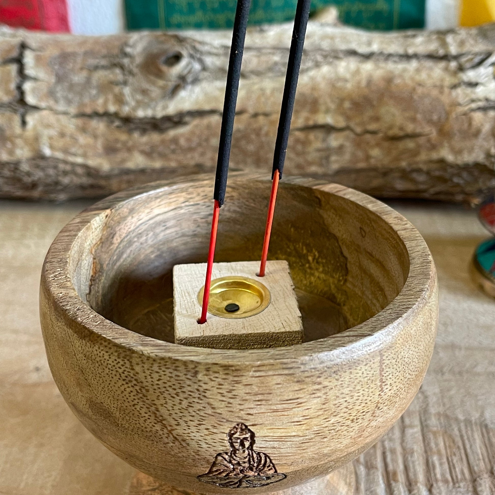 This incense holder boasts a compact and detailed design, with dimensions of 11 cm across and a 10 cm height. Its innovative design allows for the use of both incense sticks and cones, catering to a variety of incense rituals. The bowl-shaped holder showcases a delicately etched Buddha symbol on its interior, serving as a focal point and elevating its spiritual atmosphere. The meticulous engraving adds a touch of serenity, promoting a reflective and meditative atmosphere to any space. Perfect for altar sett