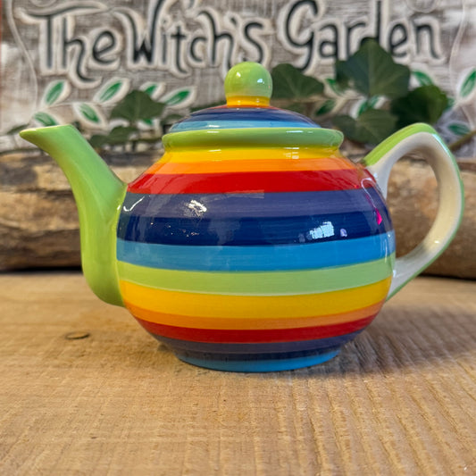 Discover our handcrafted 2-cup ceramic teapot from Thailand, featuring a vibrant rainbow design. Eco-friendly, fair-trade, dishwasher & microwave safe—perfect for elevating your tea rituals with style and sustainability.