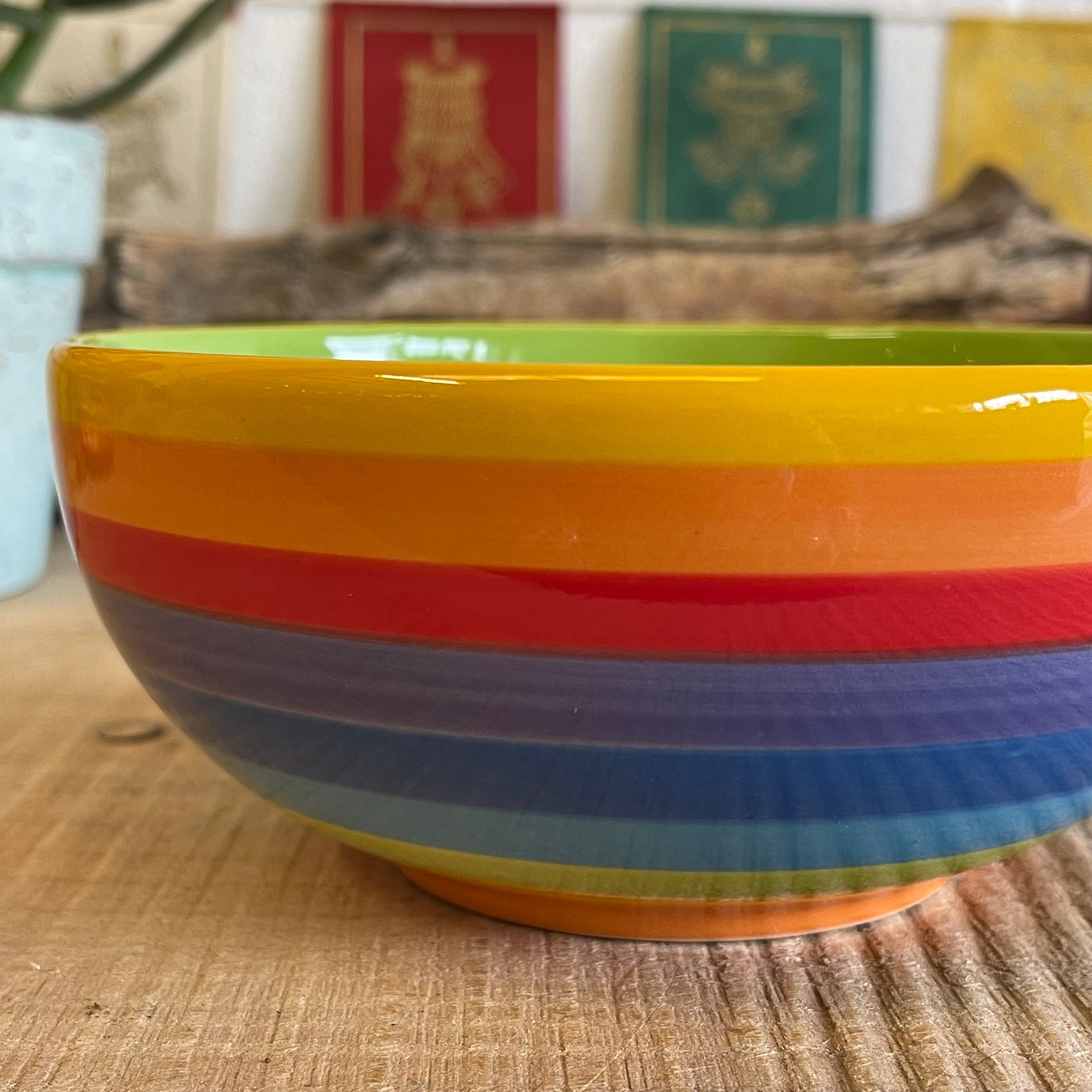 Wonderfully cheerful happy &amp; bright, this rainbow stripe ceramic bowl brightens up any home. The vibrant stripes are hand painted giving each piece individual character.  Size: 15 x 7cm  Handmade and Fairtrade from Thailand  Dishwasher and Microwave safe  Note: As these side plates are hand painted slight variations in pattern and colour can occur.