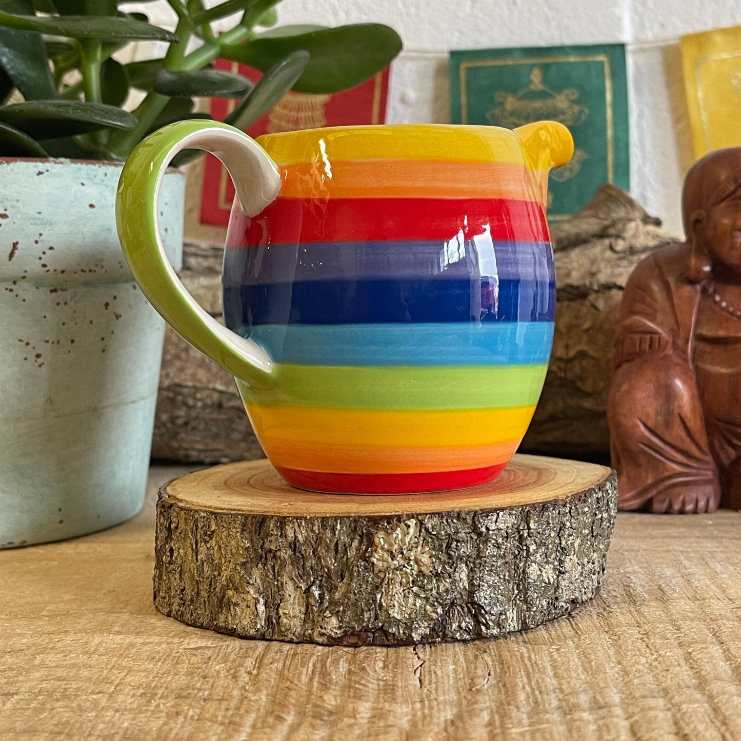 Hand painted rainbow stripe ceramic milk jug