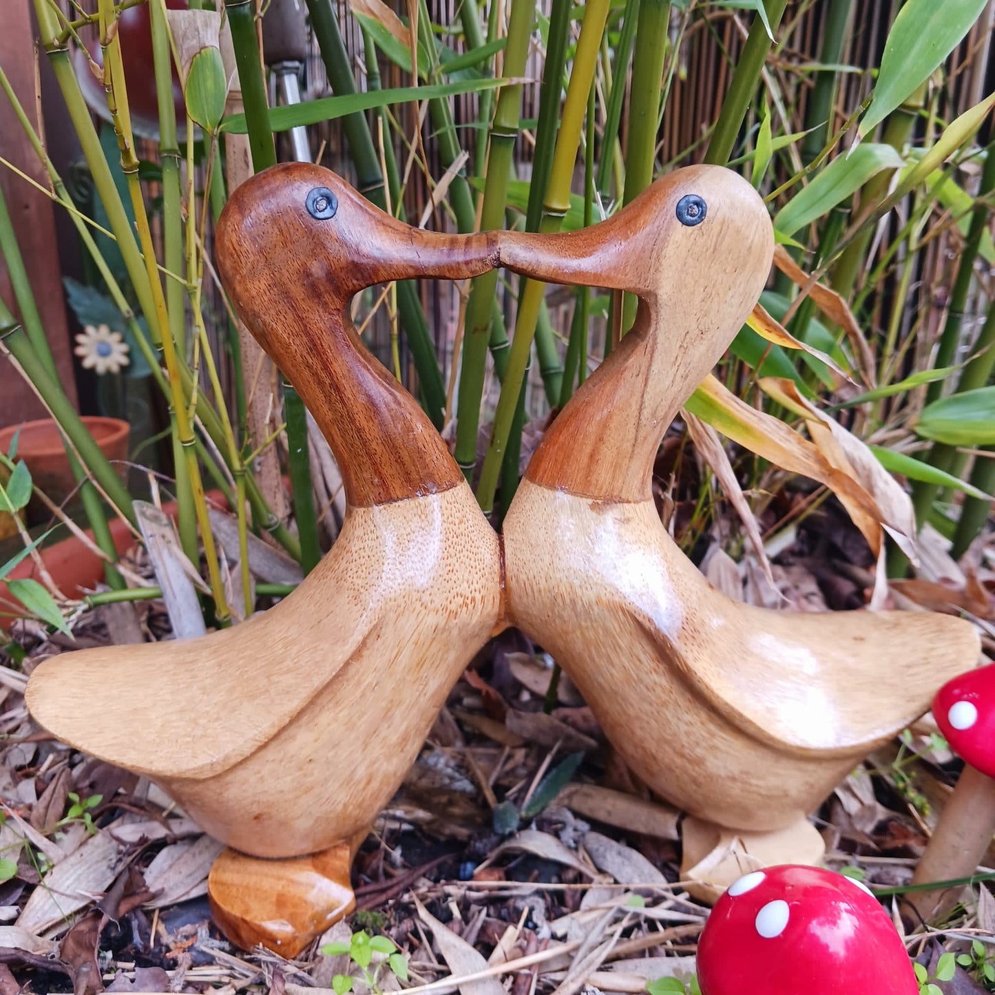 These joined pairs of ducks are carved from bamboo root in a charming beak to beak kiss. This cute little item is a perfect gift for nesting lovers.