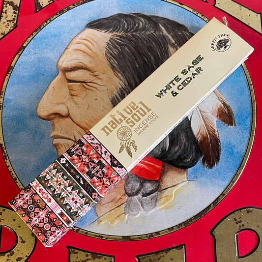 This White Sage and Cedar Native Soul Incense has been blended perfectly together to create a calming atmosphere whilst restoring balance to the mind and soul. The incense is beautifully packaged within a sliding box decorated with native American print on the outside and finished with a delicate feather on the inside Unlock the power of natural aromatherapy with our White Sage and Cedar Native Soul Incense. This carefully crafted blend creates a calming atmosphere that promotes balance of the mind and soul