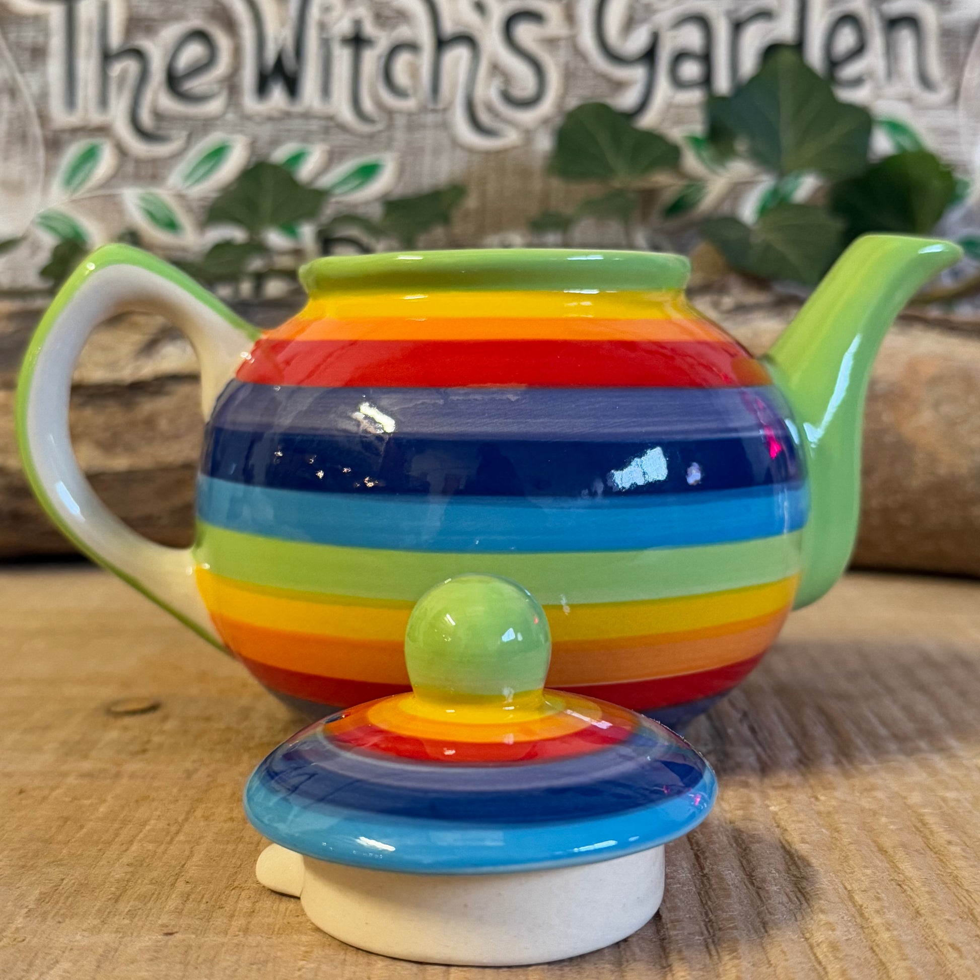 Discover our handcrafted 2-cup ceramic teapot from Thailand, featuring a vibrant rainbow design. Eco-friendly, fair-trade, dishwasher & microwave safe—perfect for elevating your tea rituals with style and sustainability.